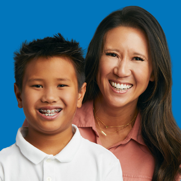 image of woman and young boy smiling wearing metal braces at dovorany orthodontics