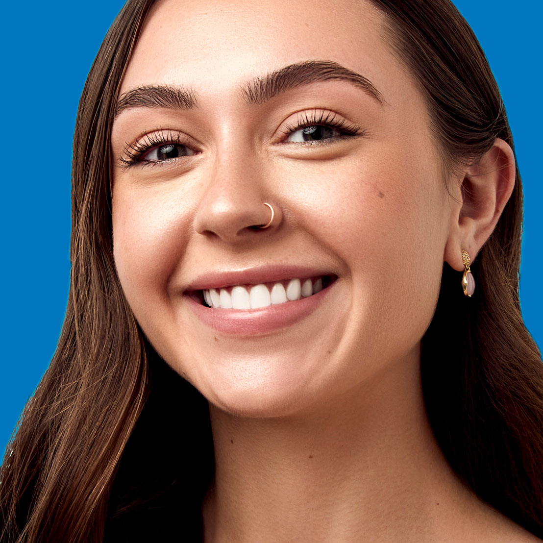 young woman smiling wearing clear Invisalign aligners at dovorany orthodontics